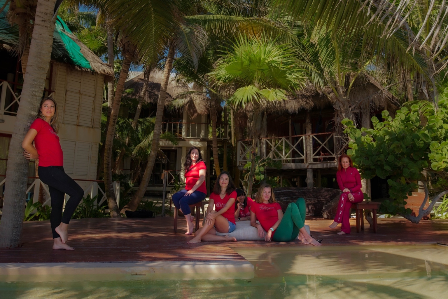 The Key2Connection team reading together beneath a banyan tree